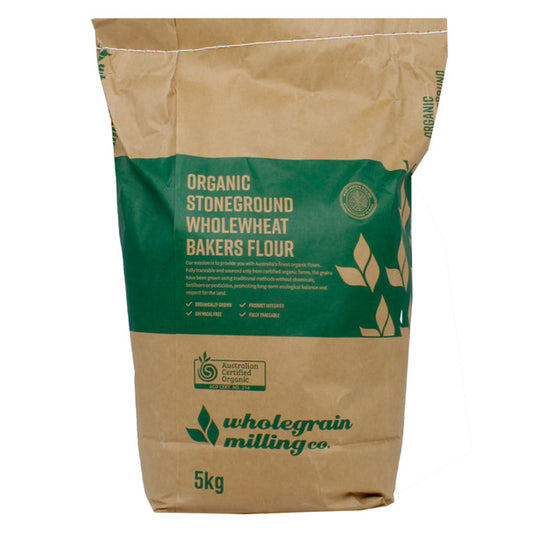A 5kg paper bag of Wholegrain Milling Co Organic Stoneground Wholewheat Bakers Flour, featuring a brown kraft paper design with a prominent green label.